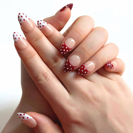 Apple Snow is a reusable handmade press-on nails set by Leme. The design delivers timeless elegance with a nude base and crisp red-and-white French tips adorned with delicate dot detailing. Each set combines precision craftsmanship with versatile styling—choose from multiple shapes and lengths to match your aesthetic and lifestyle. High-quality materials ensure durability and a flawless finish that rivals salon results. Perfect for those seeking a sophisticated, season-spanning manicure that transitions eff