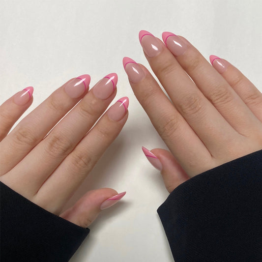 Double Sweets is a reusable handmade press-on nails set by Leme. The set offers a refined nail look featuring a nude base with short almond-shaped nails, elegantly finished with delicate pink French tips. Crafted with high-quality materials, this style ensures durability and a polished appearance, perfect for those seeking a subtle yet sophisticated manicure.