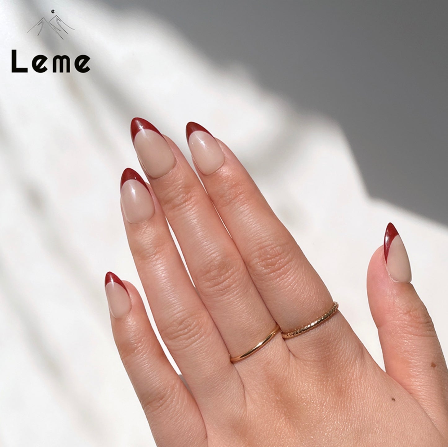 Little Cherry is a reusable handmade press-on nails set by Leme. Experience elegance with Little Cherry nails, featuring a short almond shape inspired by French design. Available in sophisticated red and nude shades, these high-quality nails offer a refined look perfect for any occasion.