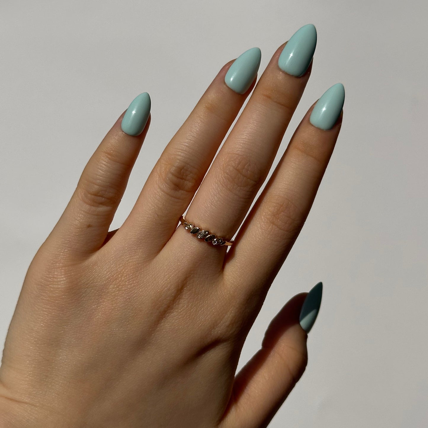Mint is a reusable handmade press-on nails set by Leme. The set featuring a light creamy turquoise shade inspired by cool summer breezes. Available in various short shapes, this collection showcases soft macaron color tones that complements any season. Crafted with high-quality materials, each set is designed for durability and effortless application, making it perfect for everyday wear or special occasions.