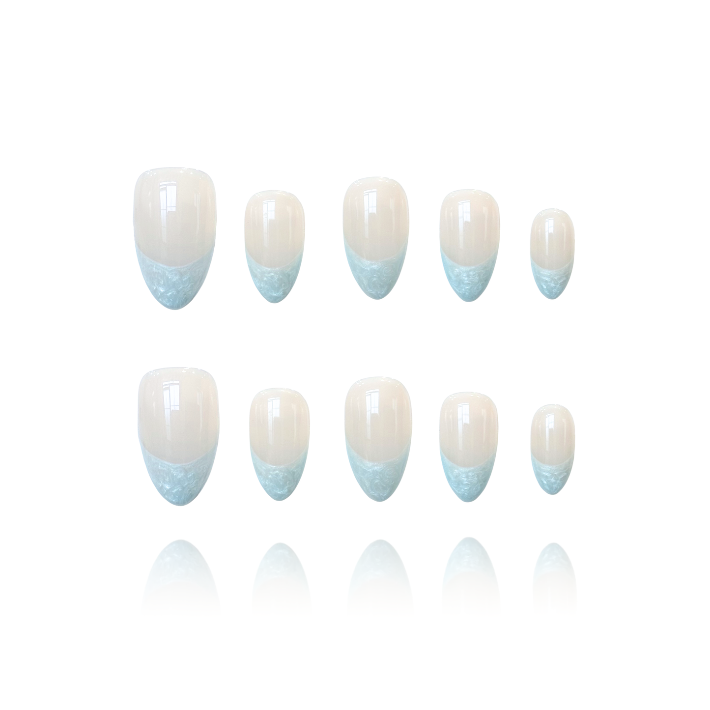 Pearly Cloud is a reusable handmade press-on nails set by Leme. The set brings timeless elegance to your fingertips. These high-quality almond-shaped press-on nails feature a sophisticated white nude base with delicate blue pearl thread French tips, creating a refined and understated look. Perfect for those who appreciate classic beauty with subtle detail, this design transitions effortlessly from everyday wear to special occasions. Simple yet stunning.