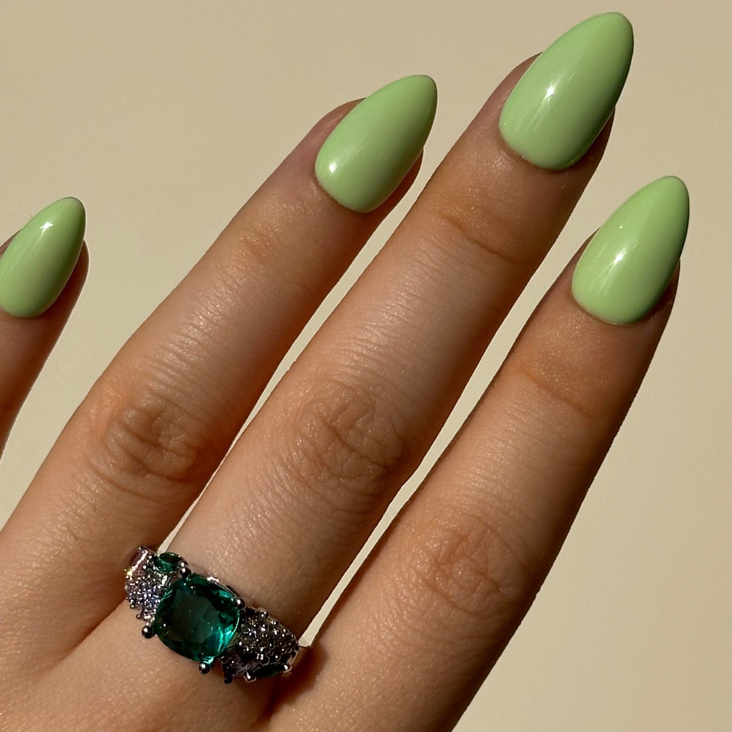 Pistachio is a reusable handmade press-on nails set by Leme. Indulge in the delicate sweetness of Pistachio—a creamy green press-on nail set inspired by the beloved macaron. It features a soft, luxurious base in rich pistachio tones, evoking the carefree spirit of summer. Available in various short shapes, these handcrafted nails blend playful charm with sophisticated elegance. Perfect for those who crave a touch of whimsy without compromising on quality. Whether you're heading to brunch or a garden party