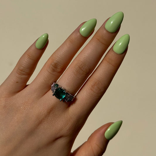 Pistachio is a reusable handmade press-on nails set by Leme. Indulge in the delicate sweetness of Pistachio—a creamy green press-on nail set inspired by the beloved macaron. It features a soft, luxurious base in rich pistachio tones, evoking the carefree spirit of summer. Available in various short shapes, these handcrafted nails blend playful charm with sophisticated elegance. Perfect for those who crave a touch of whimsy without compromising on quality. Whether you're heading to brunch or a garden party