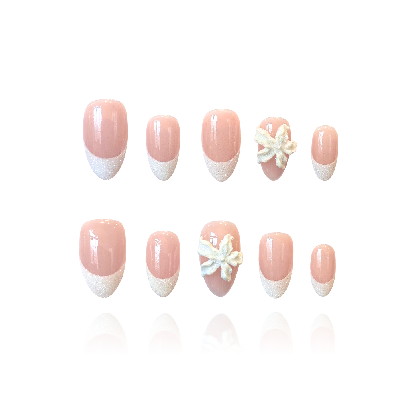Snow Lily is a reusable handmade press-on nails set by Leme. Elevate your daily look with Snow Lily, a stunning collection of press-on nails designed for timeless elegance. The set features a luxurious nude base adorned with delicate white snowflake sand French tips and intricate 3D snowflake sand lilies, creating a gorgeous, classic aesthetic perfect for all occasions. Available in two lengths, Snow Lily offers versatility to suit your personal style while maintaining that coveted feminine sophistication.