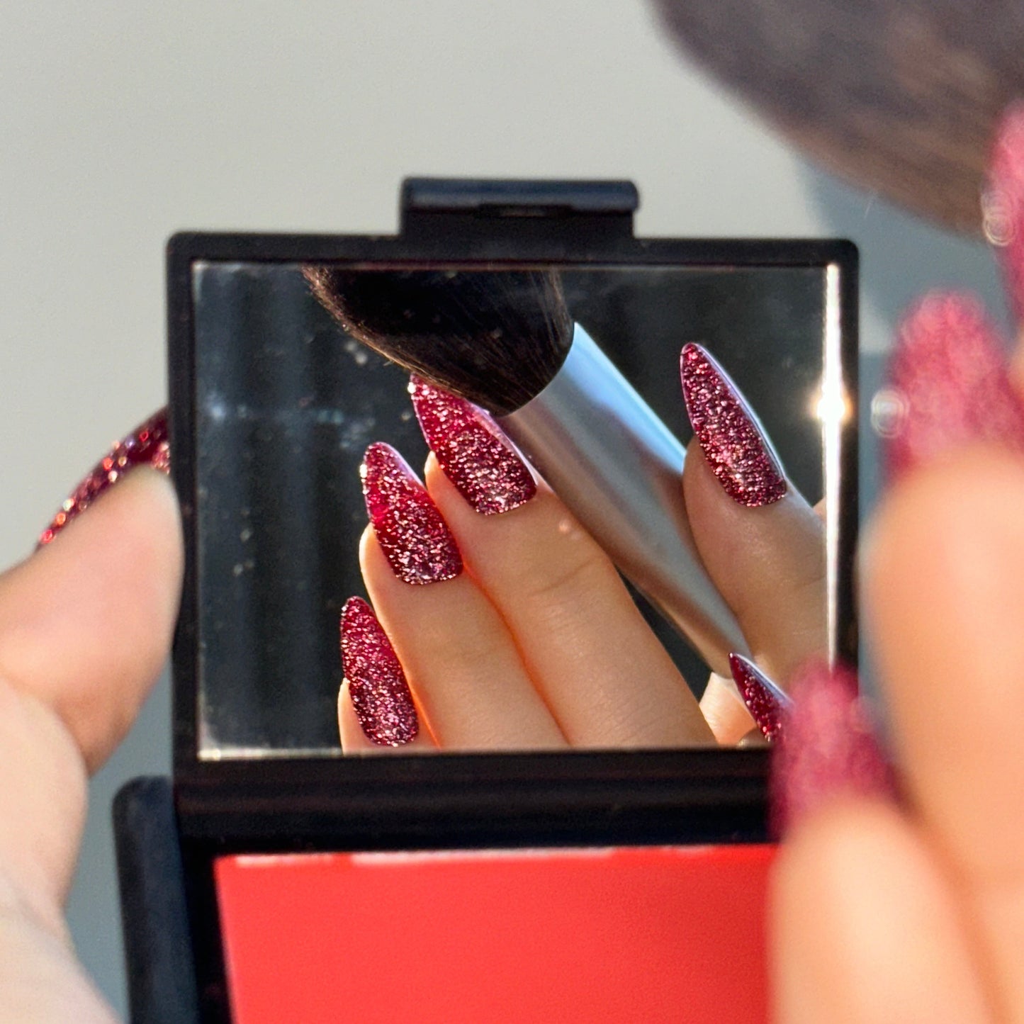 Sweatheart is a reusable handmade press-on nails set by Leme.Elevate your Valentine's Day look with these stunning medium almond-shaped nails featuring a sophisticated raspberry pink glitter base. Each nail is meticulously crafted with premium quality materials to ensure durability and a flawless finish. The intricate firework alike design adds depth and dimension, creating a captivating sparkle that catches the light beautifully. Perfect for the season of love, these nails deliver both elegance and eye-cat