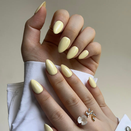 Vanilla is a reusable handmade press-on nails set by Leme. Soft, creamy vanilla tones meet playful elegance. These short-shaped nails capture a romantic macaron aesthetic—light, bright, and joyful. Handcrafted in high-quality materials, they're available in multiple short silhouettes to suit your style. Perfect for those seeking a cheerful, sophisticated look that feels both modern and timeless.