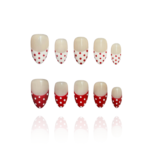 Apple Snow is a reusable handmade press-on nails set by Leme. The design delivers timeless elegance with a nude base and crisp red-and-white French tips adorned with delicate dot detailing. Each set combines precision craftsmanship with versatile styling—choose from multiple shapes and lengths to match your aesthetic and lifestyle. High-quality materials ensure durability and a flawless finish that rivals salon results. Perfect for those seeking a sophisticated, season-spanning manicure that transitions eff
