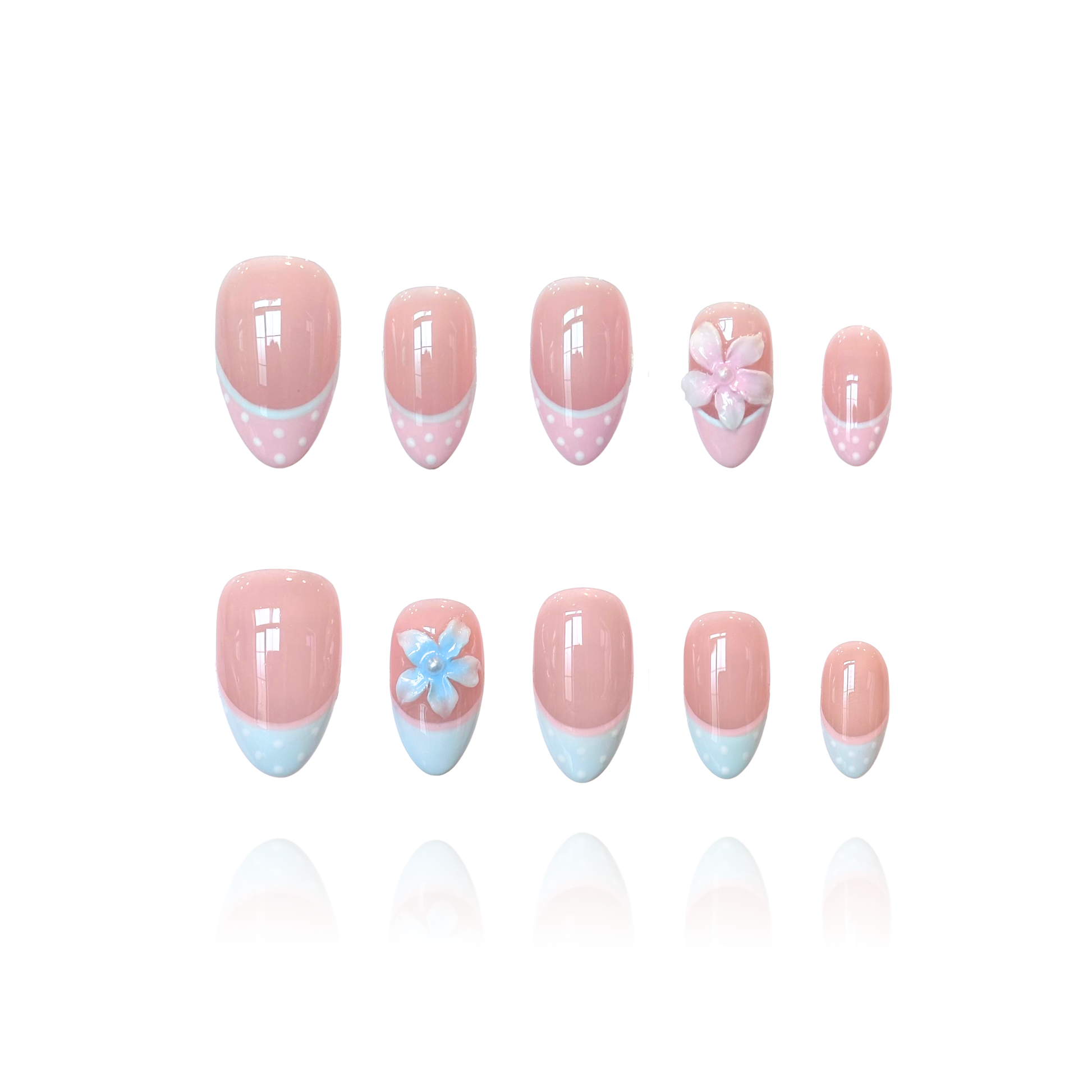 Bambi is a reusable handmade press-on nails set by Leme. The nails feature a soft nude base with delicate pink and blue French tips adorned with playful polka dots. The set showcases 3D handcrafted flowers for added dimension and charm. Available in multiple shapes to suit your preference, these high-quality nails deliver a cute, sophisticated look perfect for any occasion. Simply apply and enjoy salon-worthy results at home.