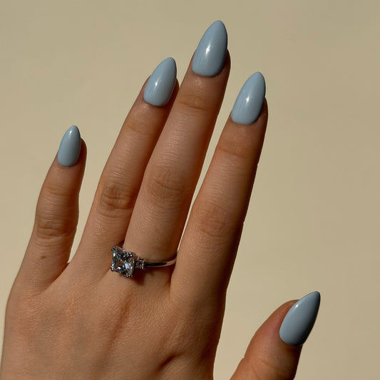 Blueberry is a reusable handmade press-on nails set by Leme. The set brings effortless elegance to your summer look. Crafted in a soft, dreamy baby blue with delicate macaron undertones, these high-quality nails feature various short shapes to suit every style and occasion. Each set is handmade for a premium finish that feels as luxurious as it looks. Perfect for those seeking a refined, understated aesthetic—reusable, comfortable, and ready to elevate your everyday beauty routine.