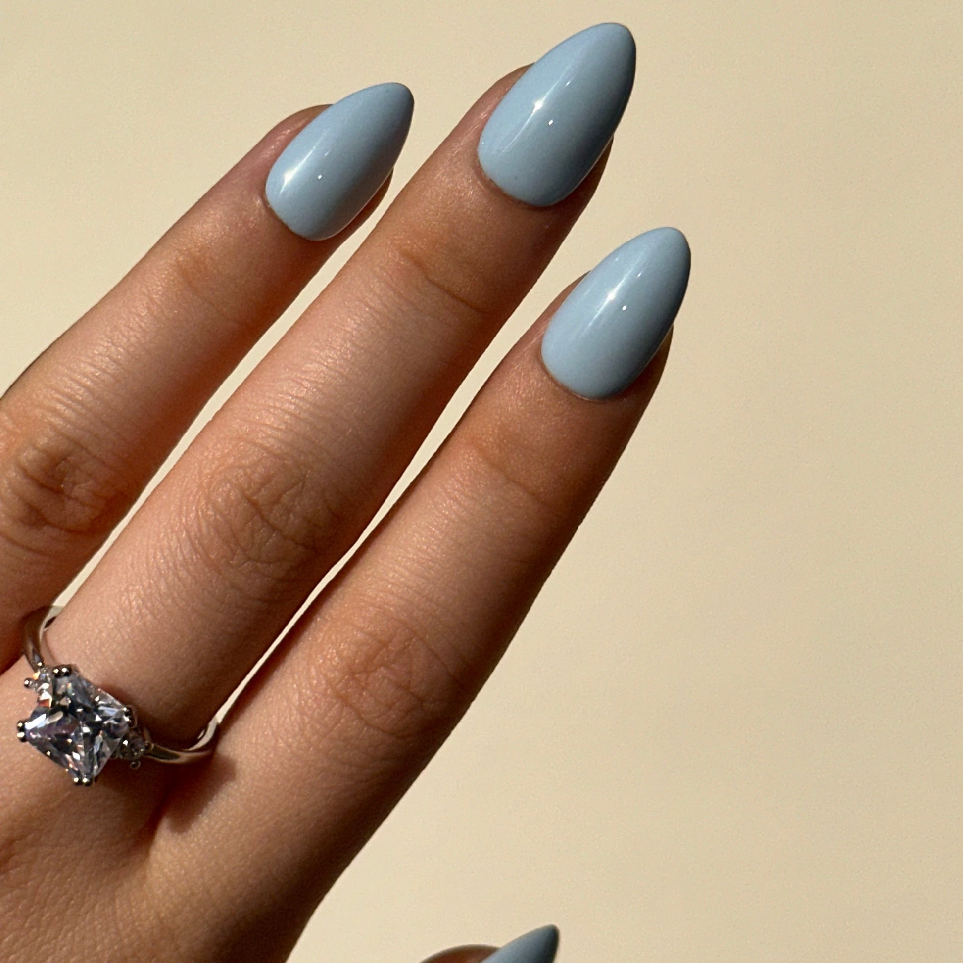 Blueberry is a reusable handmade press-on nails set by Leme. The set brings effortless elegance to your summer look. Crafted in a soft, dreamy baby blue with delicate macaron undertones, these high-quality nails feature various short shapes to suit every style and occasion. Each set is handmade for a premium finish that feels as luxurious as it looks. Perfect for those seeking a refined, understated aesthetic—reusable, comfortable, and ready to elevate your everyday beauty routine.