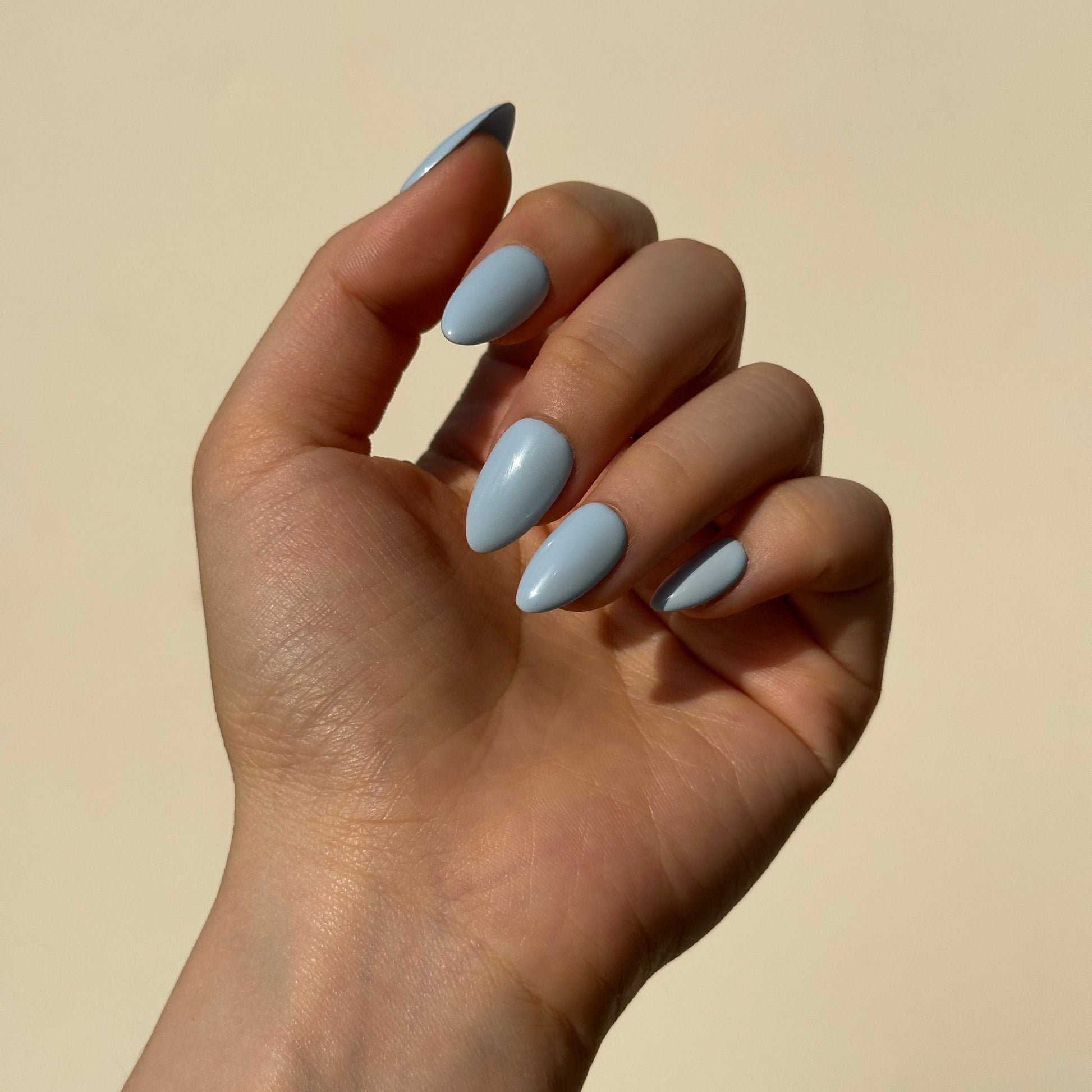Blueberry is a reusable handmade press-on nails set by Leme. The set brings effortless elegance to your summer look. Crafted in a soft, dreamy baby blue with delicate macaron undertones, these high-quality nails feature various short shapes to suit every style and occasion. Each set is handmade for a premium finish that feels as luxurious as it looks. Perfect for those seeking a refined, understated aesthetic—reusable, comfortable, and ready to elevate your everyday beauty routine.