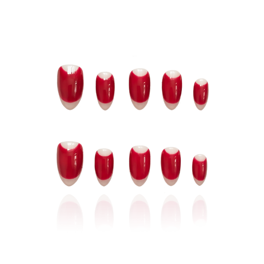 Bold Romance is a reusable handmade press-on nails set by Leme. Experience the elegance of Bold Romance, featuring short almond-shaped nails crafted with high-quality materials. The rich red hue adds a sophisticated and timeless touch to the French design, perfect for making a confident statement with expert precision.