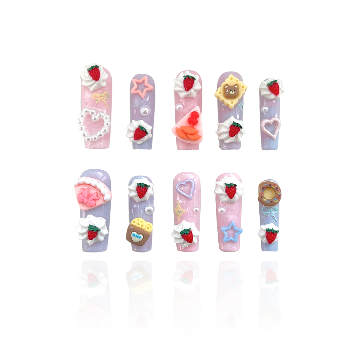 Butter Dream is a reusable handmade press-on nails set by Leme. Experience the Butter Dream from the Candy Cream Collection — high-quality 3D press-on nails featuring a long coffin shape. These light pink and purple nails showcase charming designs inspired by cakes, teddy bears, and desserts, adding a playful yet sophisticated touch to your look. Durable and easy to apply, they offer a flawless finish perfect for elevating any style with expert precision.