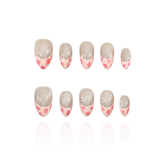 Cute Leopard is a reusable handmade press-on nails set by Leme. These high-quality nails feature a short almond shape with a chic pink leopard pattern and elegant French tips. The nude base enhances the design’s sophistication, making them perfect for a stylish, polished look.