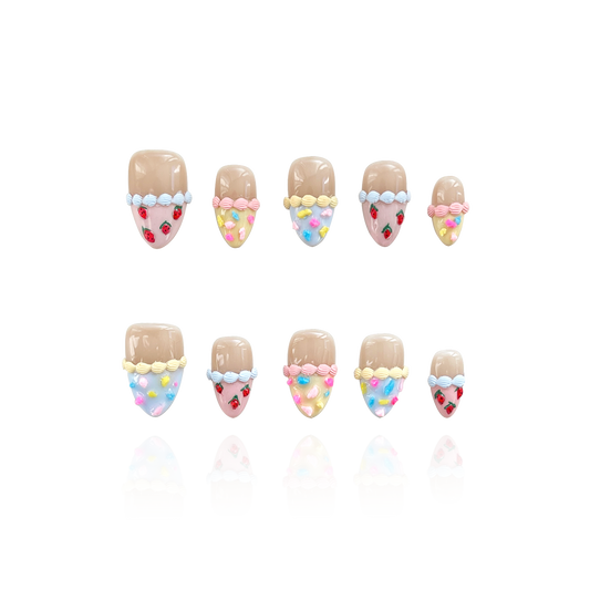 Candy Quake is a reusable handmade press-on nails set by Leme. Part of the Candy Cream collection, the set offers short almond-shaped, 3D press-on nails in a delicate mix of nude, blue, yellow, and pink hues inspired by strawberries and cream. Handmade with high-quality materials, these reusable nails provide a durable, elegant finish for a polished look with effortless application.