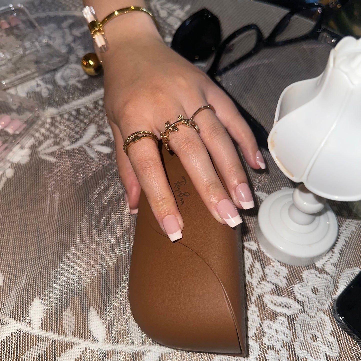 Cream Cloud is a reusable handmade press-on nails set by Leme. The set comes with multiple shapes and lengths. Featuring a refined nude base paired with classic white French tips, this design delivers a polished and versatile look. Made with premium materials, it guarantees long-lasting wear and a smooth, professional finish suitable for any occasion.