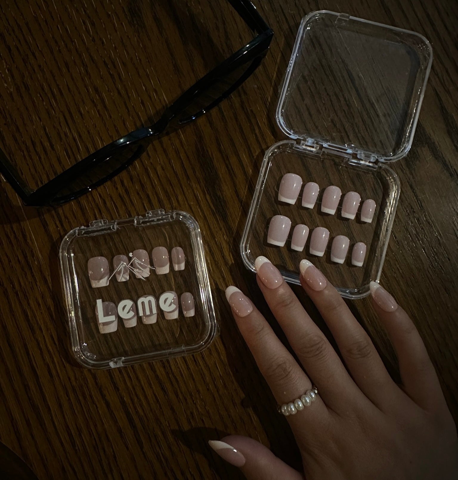 Cream Cloud is a reusable handmade press-on nails set by Leme. The set comes with multiple shapes and lengths. Featuring a refined nude base paired with classic white French tips, this design delivers a polished and versatile look. Made with premium materials, it guarantees long-lasting wear and a smooth, professional finish suitable for any occasion.