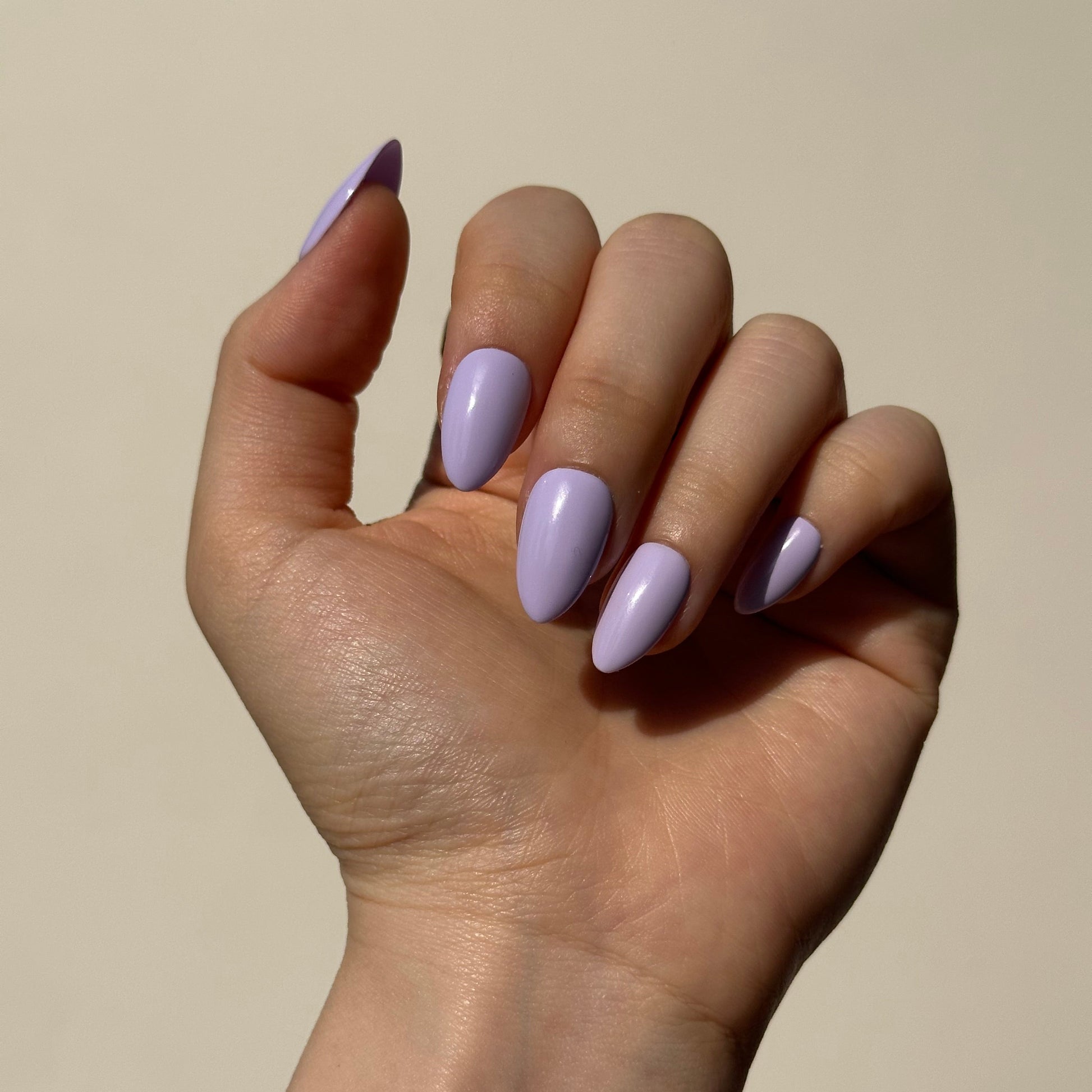 Fig is a reusable handmade press-on nails set by Leme. The set captures the essence of romantic elegance in a milky purple palette with soft macaron undertones. This reusable handmade press-on nail set features a curated selection of short shapes, each meticulously crafted to deliver a sophisticated, understated look. Perfect for those seeking a refined aesthetic that transitions effortlessly from day to evening. Handmade quality ensures durability and a premium finish that lasts through multiple applicatio