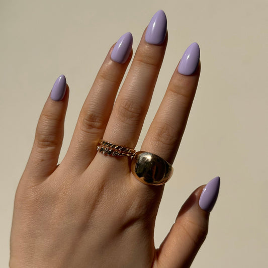 Fig is a reusable handmade press-on nails set by Leme. The set captures the essence of romantic elegance in a milky purple palette with soft macaron undertones. This reusable handmade press-on nail set features a curated selection of short shapes, each meticulously crafted to deliver a sophisticated, understated look. Perfect for those seeking a refined aesthetic that transitions effortlessly from day to evening. Handmade quality ensures durability and a premium finish that lasts through multiple applicatio