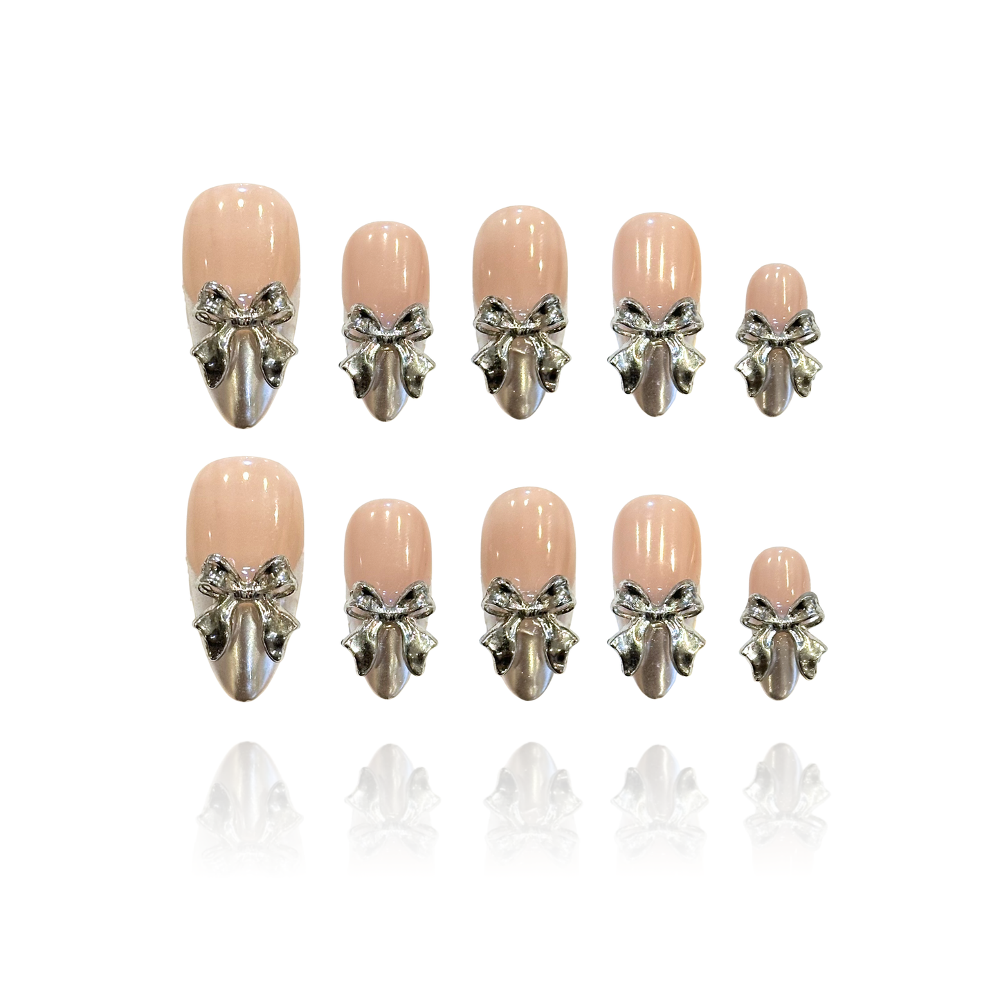 Flying Platinum is a reusable handmade press-on nails set by Leme. Elevate your nail game with Flying Platinum, a stunning set of medium almond-shaped press-on nails designed for the modern sophisticate. Each nail features a luxurious nude base paired with high-shine silver chrome French tips and intricate 3D silver bowties that catch the light beautifully. Handcrafted for a premium finish, these reusable nails deliver salon-quality results in seconds. Perfect for adding a touch of elegance to any occasion,