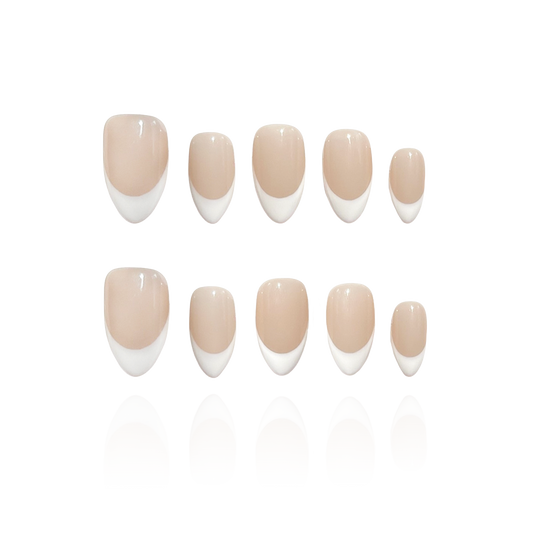 Lady G is a reusable handmade press-on nails set by Leme. The set offers a refined manicure featuring white French tips over a nude base, perfectly crafted in a short almond shape. This elegant design combines classic sophistication with modern subtlety, ideal for those seeking a polished and high-quality look. The precise application ensures durability and a flawless finish, making it suitable for both everyday wear and special occasions.