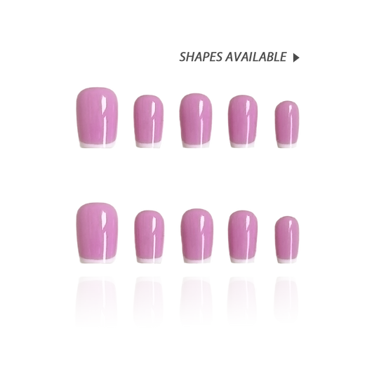 Lilac Split is a reusable handmade press-on nails set by Leme. This elegant nail design features a soft pink base complemented by crisp white French tips, offering a timeless and sophisticated look. The set comes with multiple shapes and lengths. Crafted with high-quality materials, it ensures durability and a flawless finish, perfect for both everyday wear and special occasions.