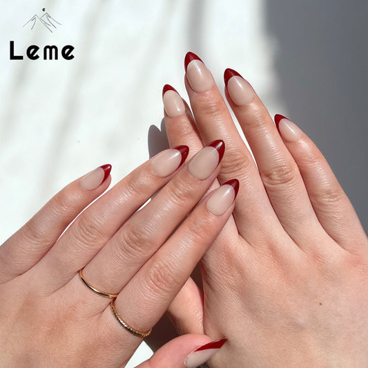 Little Cherry is a reusable handmade press-on nails set by Leme. Experience elegance with Little Cherry nails, featuring a short almond shape inspired by French design. Available in sophisticated red and nude shades, these high-quality nails offer a refined look perfect for any occasion.