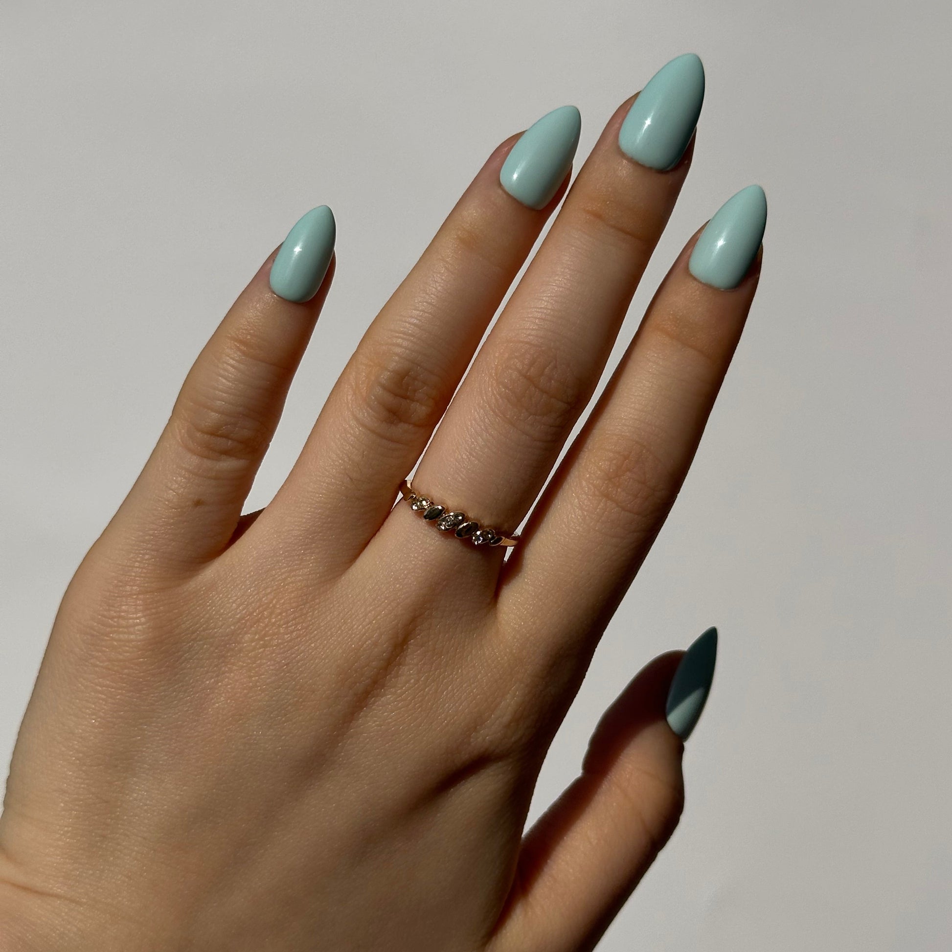Mint is a reusable handmade press-on nails set by Leme. The set featuring a light creamy turquoise shade inspired by cool summer breezes. Available in various short shapes, this collection showcases soft macaron color tones that complements any season. Crafted with high-quality materials, each set is designed for durability and effortless application, making it perfect for everyday wear or special occasions.