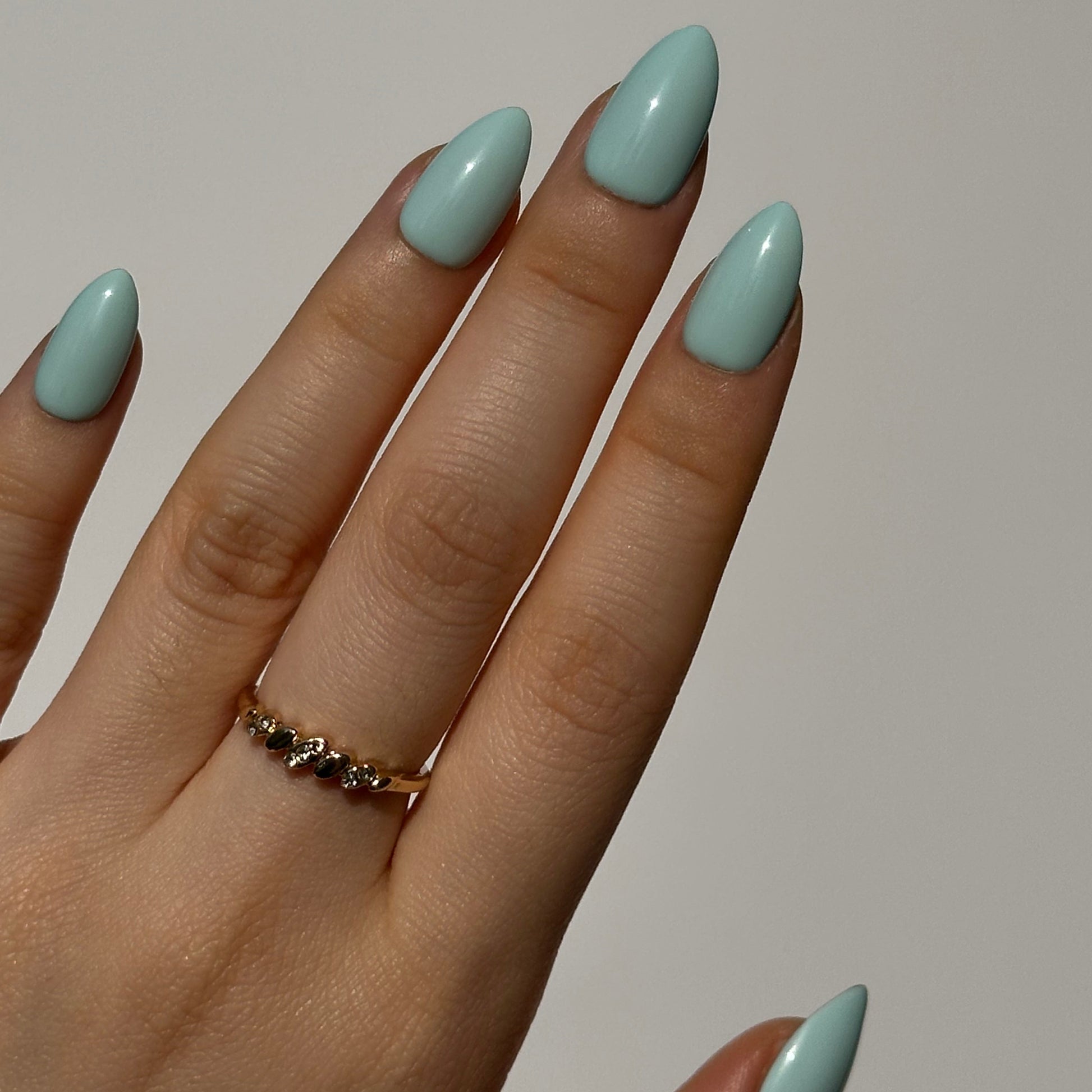 Mint is a reusable handmade press-on nails set by Leme. The set featuring a light creamy turquoise shade inspired by cool summer breezes. Available in various short shapes, this collection showcases soft macaron color tones that complements any season. Crafted with high-quality materials, each set is designed for durability and effortless application, making it perfect for everyday wear or special occasions.