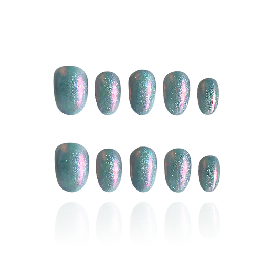 Mermaid Tears is a reusable handmade press-on nails set by Leme. These high-quality cat-eye sunglasses feature a distinctive short oval shape, blending green and pink hues for a unique, sophisticated look. Designed for those who appreciate expert craftsmanship, "Mermaid Tears" offers both style and durability in one elegant accessory.