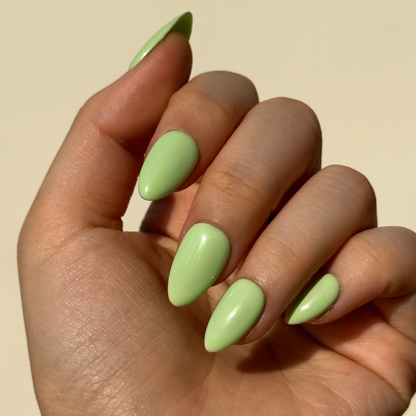 Pistachio is a reusable handmade press-on nails set by Leme. Indulge in the delicate sweetness of Pistachio—a creamy green press-on nail set inspired by the beloved macaron. It features a soft, luxurious base in rich pistachio tones, evoking the carefree spirit of summer. Available in various short shapes, these handcrafted nails blend playful charm with sophisticated elegance. Perfect for those who crave a touch of whimsy without compromising on quality. Whether you're heading to brunch or a garden party