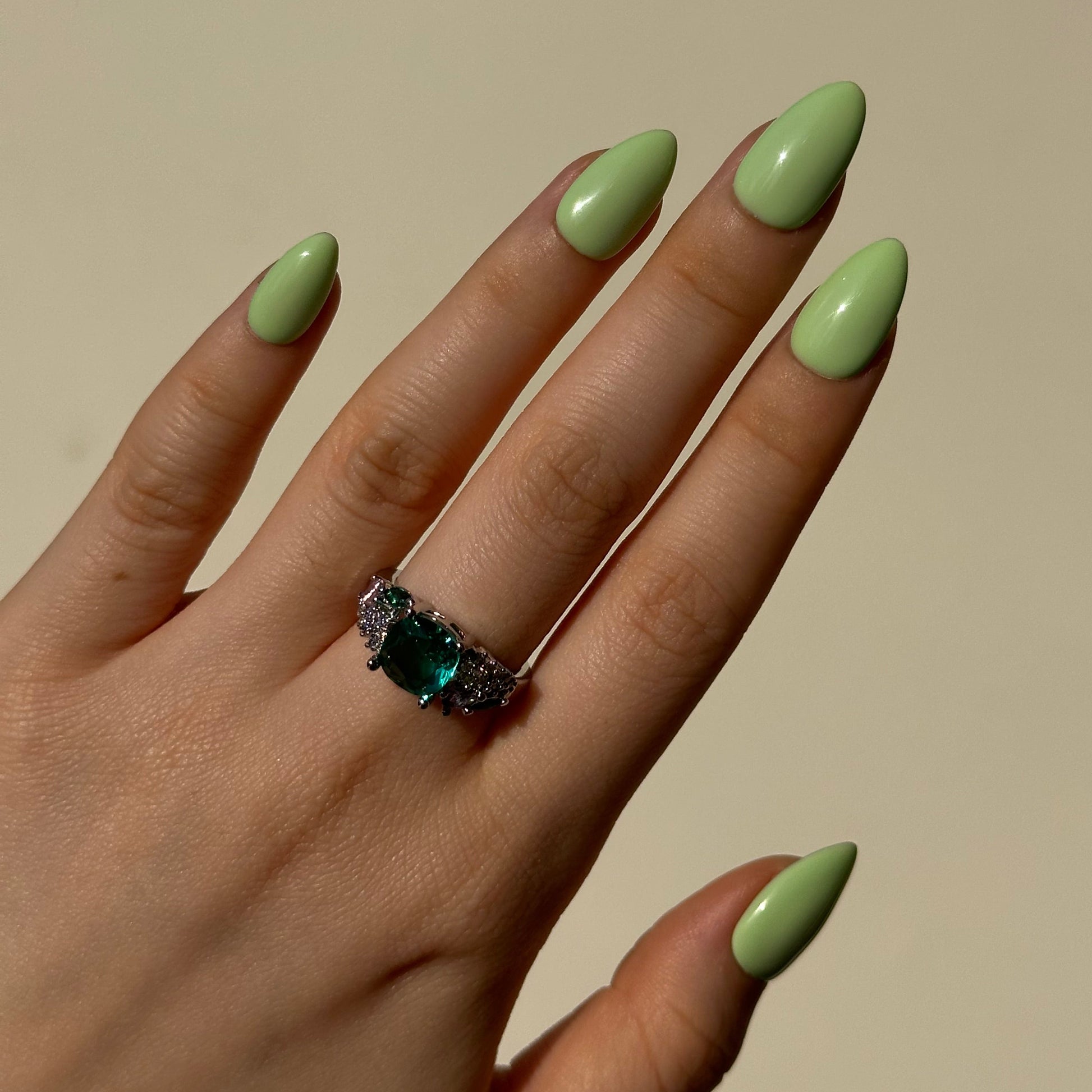 Pistachio is a reusable handmade press-on nails set by Leme. Indulge in the delicate sweetness of Pistachio—a creamy green press-on nail set inspired by the beloved macaron. It features a soft, luxurious base in rich pistachio tones, evoking the carefree spirit of summer. Available in various short shapes, these handcrafted nails blend playful charm with sophisticated elegance. Perfect for those who crave a touch of whimsy without compromising on quality. Whether you're heading to brunch or a garden party