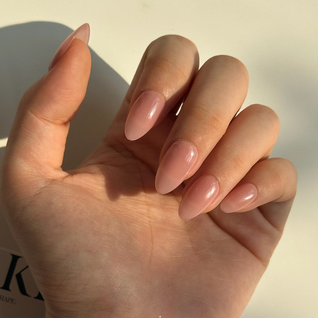 Rosy Blush is a reusable handmade press-on nails set by Leme. It features a refined short almond silhouette in a delicate pink shade. Crafted from premium materials, these nails deliver a sophisticated, salon-quality finish that complements any occasion. The expertly tapered shape flatters the fingertip while maintaining practical everyday wearability. Perfect for those seeking understated elegance with superior durability and a flawless appearance.