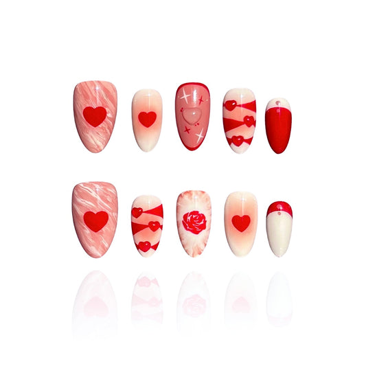Rosy Ocean is a reusable handmade press-on nails set by Leme. Rosy Ocean captures the essence of romance with its expertly crafted design. Featuring hand-drawn rose paired with delicate 3D hearts, this short almond-shaped nail set delivers a sophisticated yet playful aesthetic. The Valentine's collection showcases a harmonious blend of white, pink, and red tones that complement any complexion. Each nail displays meticulous attention to detail, making this a standout choice for those seeking distinctive, hig