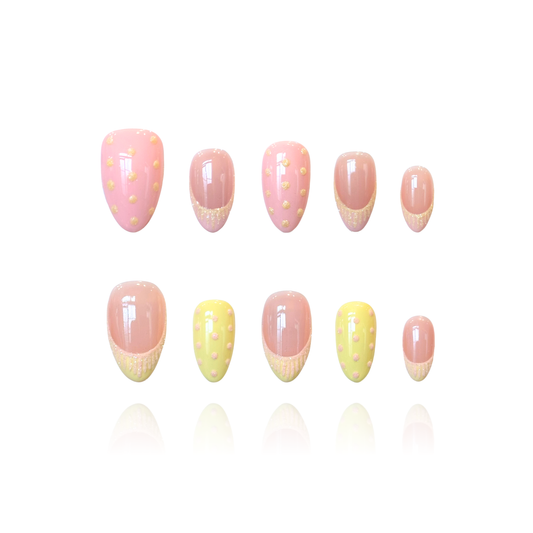 Sugar Dots is a reusable handmade press-on nails set by Leme. Delicate almond-shaped press-on nails featuring soft pink and yellow French tips adorned with charming snowflake sand detailing. Sparkle polka dots dance across each nail for an enchanting, playful look. Perfect for adding a touch of dessert-inspired elegance to your manicure. High-quality construction ensures durability and a flawless finish every time.

