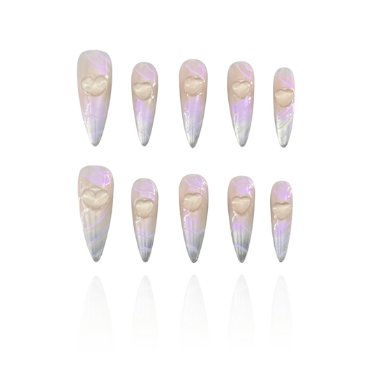 Time Machine is a reusable handmade press-on nails set by Leme. Elevate your nail art with the "Time Machine" set, featuring high-quality, long stiletto-shaped nails. Each piece showcases a sophisticated nude and silver base, enhanced by a striking purple-pink chrome finish. The standout 3D heart decoration adds a unique, expert touch, perfect for those seeking a blend of elegance and bold style. Ideal for making a lasting impression with refined craftsmanship and contemporary design.