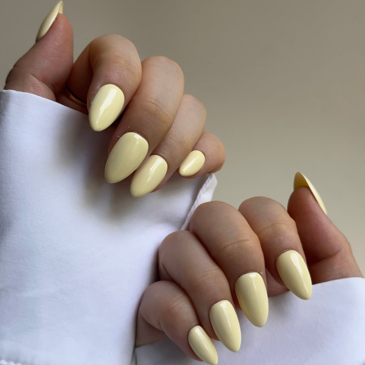 Vanilla is a reusable handmade press-on nails set by Leme. Soft, creamy vanilla tones meet playful elegance. These short-shaped nails capture a romantic macaron aesthetic—light, bright, and joyful. Handcrafted in high-quality materials, they're available in multiple short silhouettes to suit your style. Perfect for those seeking a cheerful, sophisticated look that feels both modern and timeless.