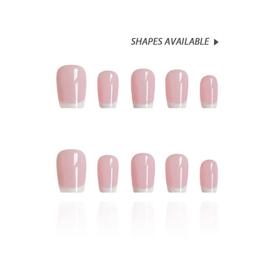 Vanilla Rose is a reusable handmade press-on nails set by Leme. Experience timeless elegance with these high-quality press-on nails featuring a delicate pink base and crisp white French tips. The set comes with multiple shapes and lengths.  Perfectly crafted for a sophisticated look, they combine classic style with modern precision to enhance your natural beauty effortlessly. Ideal for any occasion, these nails offer durability and a refined finish that stands out with subtle grace.