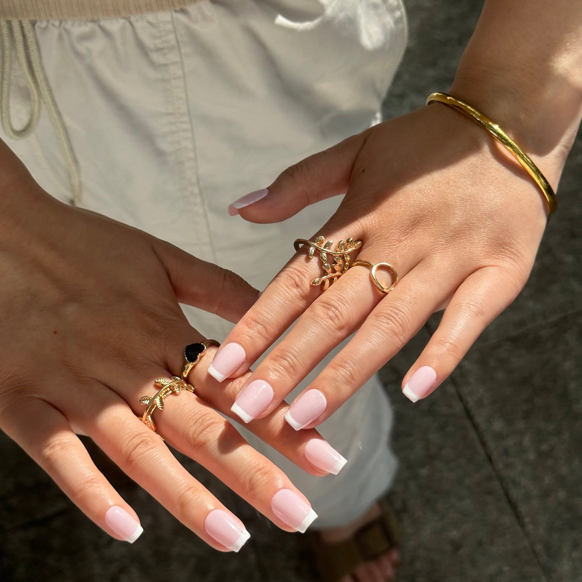 Vanilla Rose is a reusable handmade press-on nails set by Leme. Experience timeless elegance with these high-quality press-on nails featuring a delicate pink base and crisp white French tips. The set comes with multiple shapes and lengths.  Perfectly crafted for a sophisticated look, they combine classic style with modern precision to enhance your natural beauty effortlessly. Ideal for any occasion, these nails offer durability and a refined finish that stands out with subtle grace.

