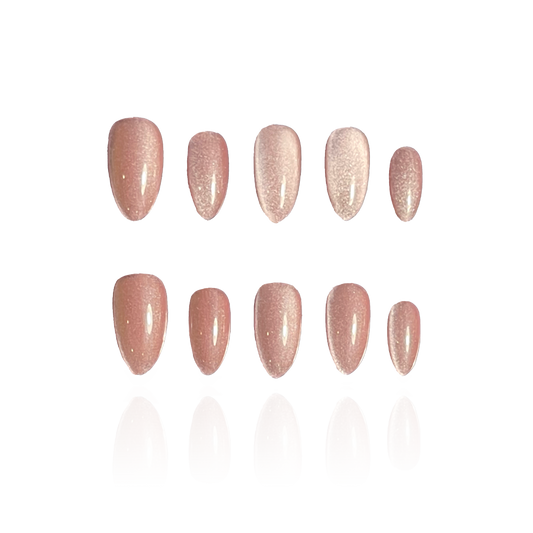 Velvet Pink is a reusable handmade press-on nails set by Leme.  Elevate your look with Velvet Pink, featuring a sophisticated cat-eye design in a short almond shape. This high-quality nail polish offers a smooth, nude pink finish that complements any style with subtle elegance. Perfect for those seeking a refined yet modern manicure.