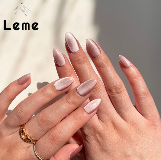 Velvet Pink is a reusable handmade press-on nails set by Leme.  Elevate your look with Velvet Pink, featuring a sophisticated cat-eye design in a short almond shape. This high-quality nail polish offers a smooth, nude pink finish that complements any style with subtle elegance. Perfect for those seeking a refined yet modern manicure.