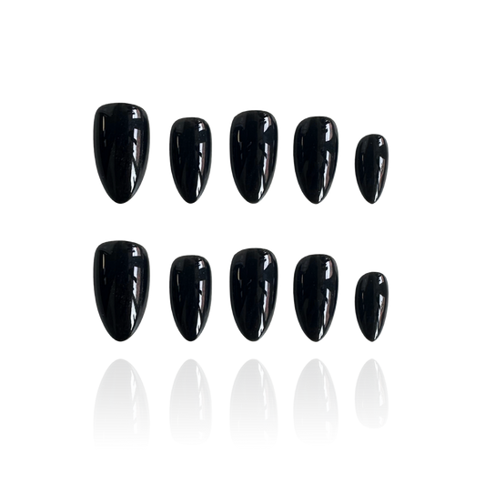 Why Kill is a reusable handmade press-on nails set by Leme, crafted in sleek black with various shapes and lengths to suit your style. Handcrafted with meticulous attention to detail, Why Kill delivers salon-quality results at home. Each nail is individually finished to exacting standards, ensuring a flawless fit and professional appearance every time you wear them. 