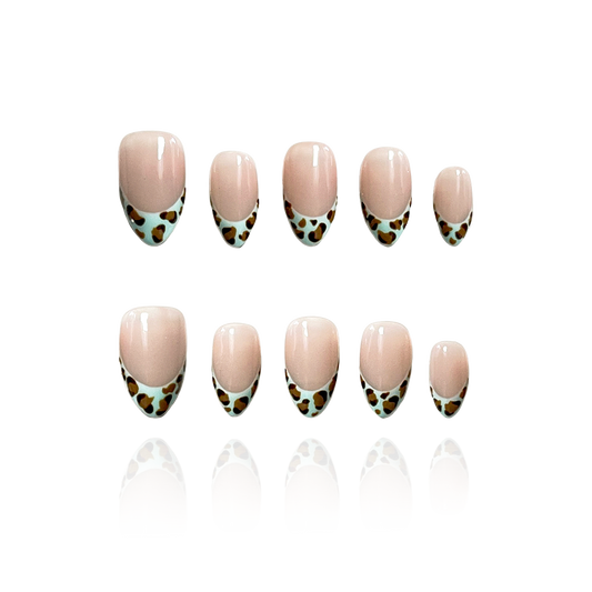 Mint Leopard is a reusable handmade press-on nails set by Leme. Enhance your manicure with these expertly designed French tips featuring a mint-colored leopard pattern. Featuring a nude base and a short almond shape, this design combines subtle elegance with a bold, modern twist. Made with high-quality materials, these nails offer durability and a flawless finish, perfect for those seeking a sophisticated yet trendy look.
